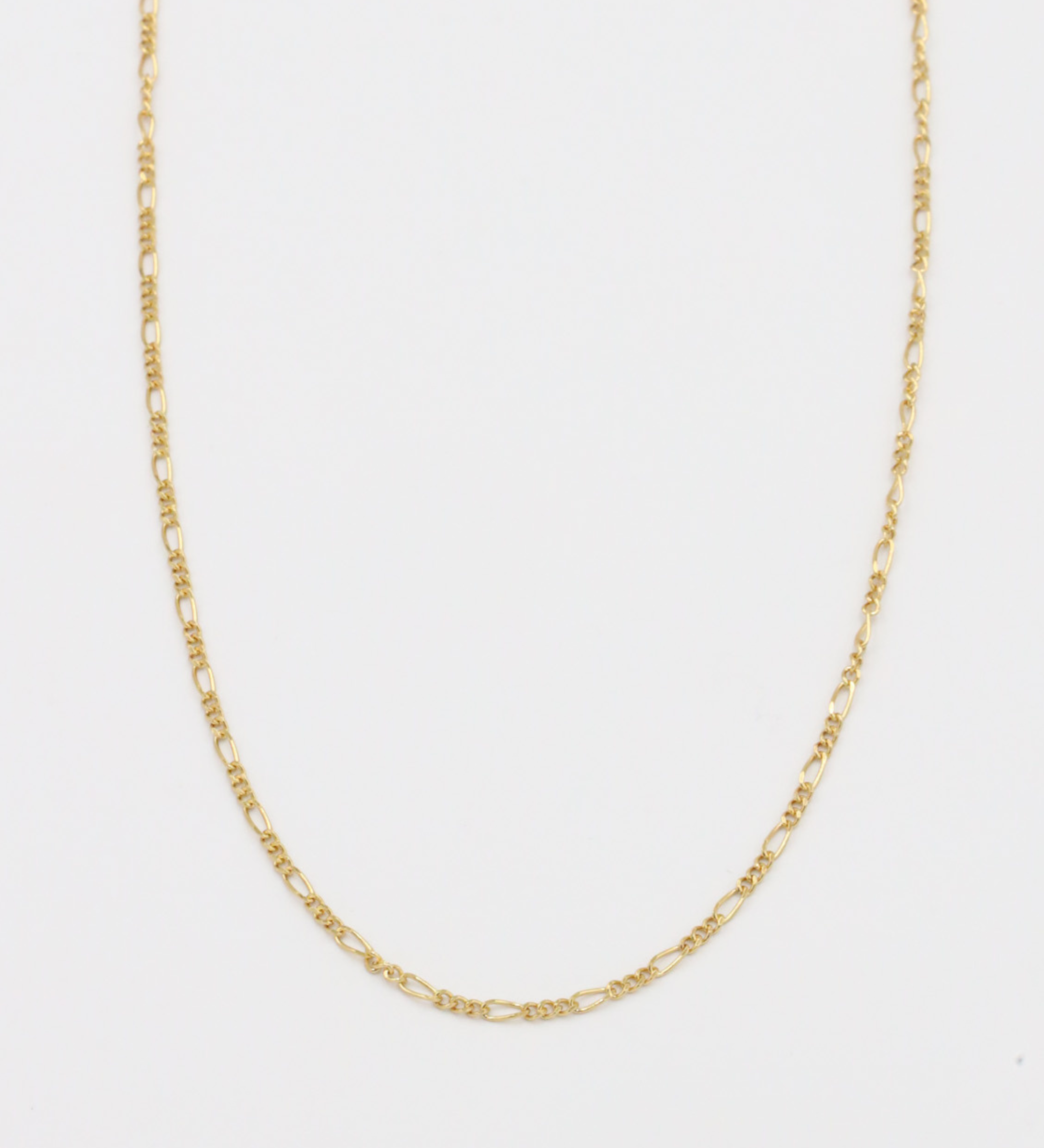 Closeup view of the Annabelle necklace in gold, showcasing its delicate chain design made from gold-plated 925 sterling silver.
