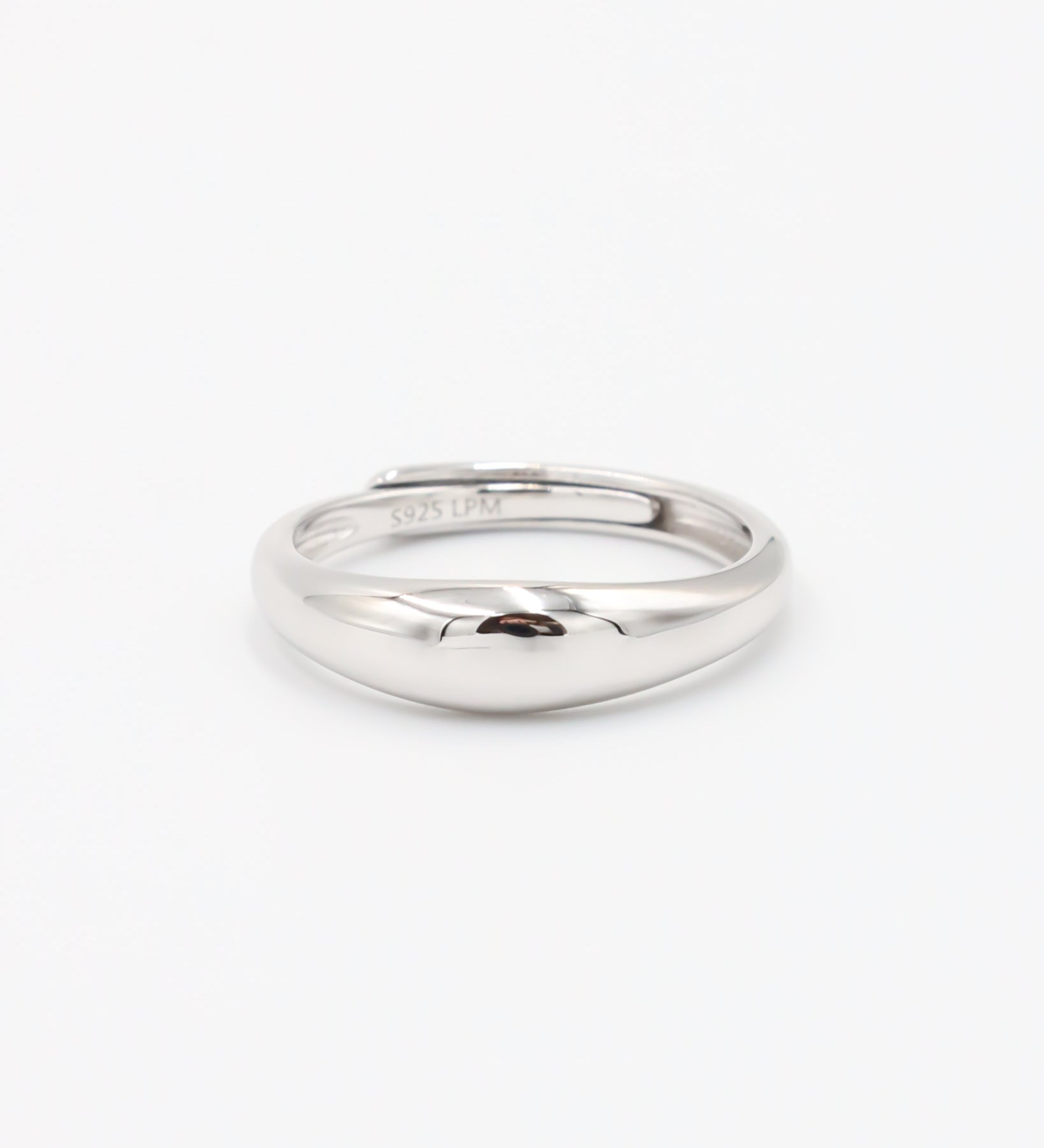 A single silver ring with a smooth, shiny finish displayed against a white background.