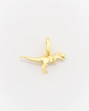 Gold dinosaur pendant on a white background