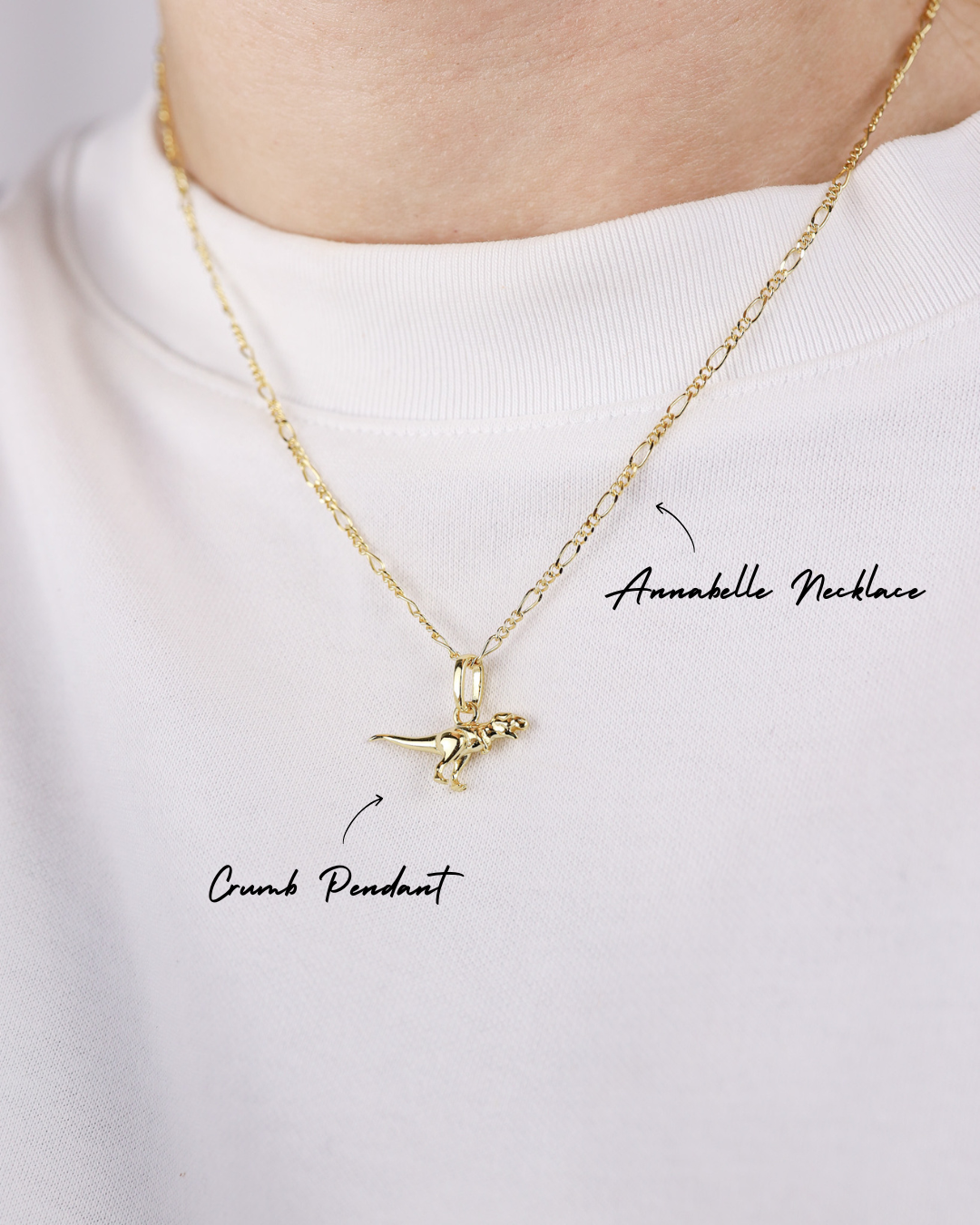 Gold necklace with a pendant on a white background