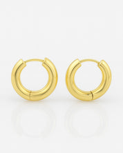 Gold hoop earrings on a white background