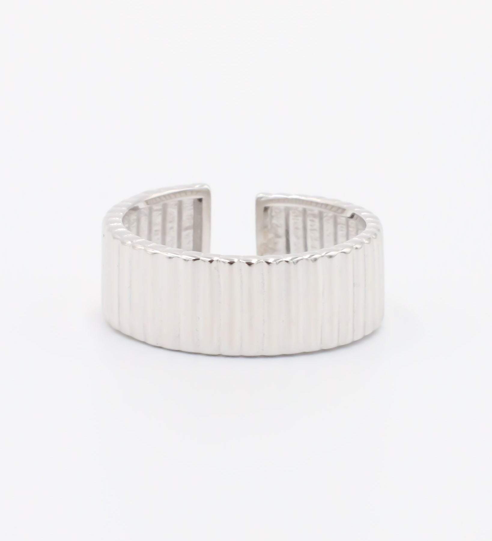 An adjustable sterling silver ring with a textured band, displayed on a white background.