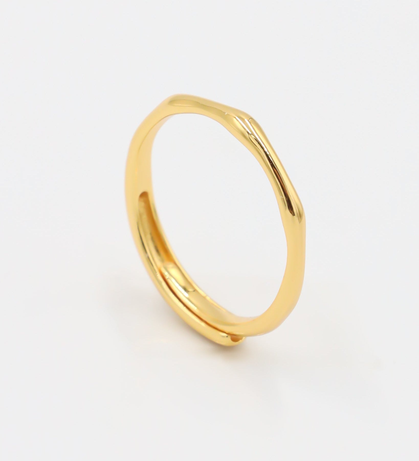 Lisanne - adjustable gold-plated sterling silver ring, minimalist design, side view.