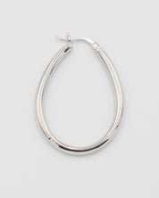 A single silver creole earring with a latch back clasp on a white background.