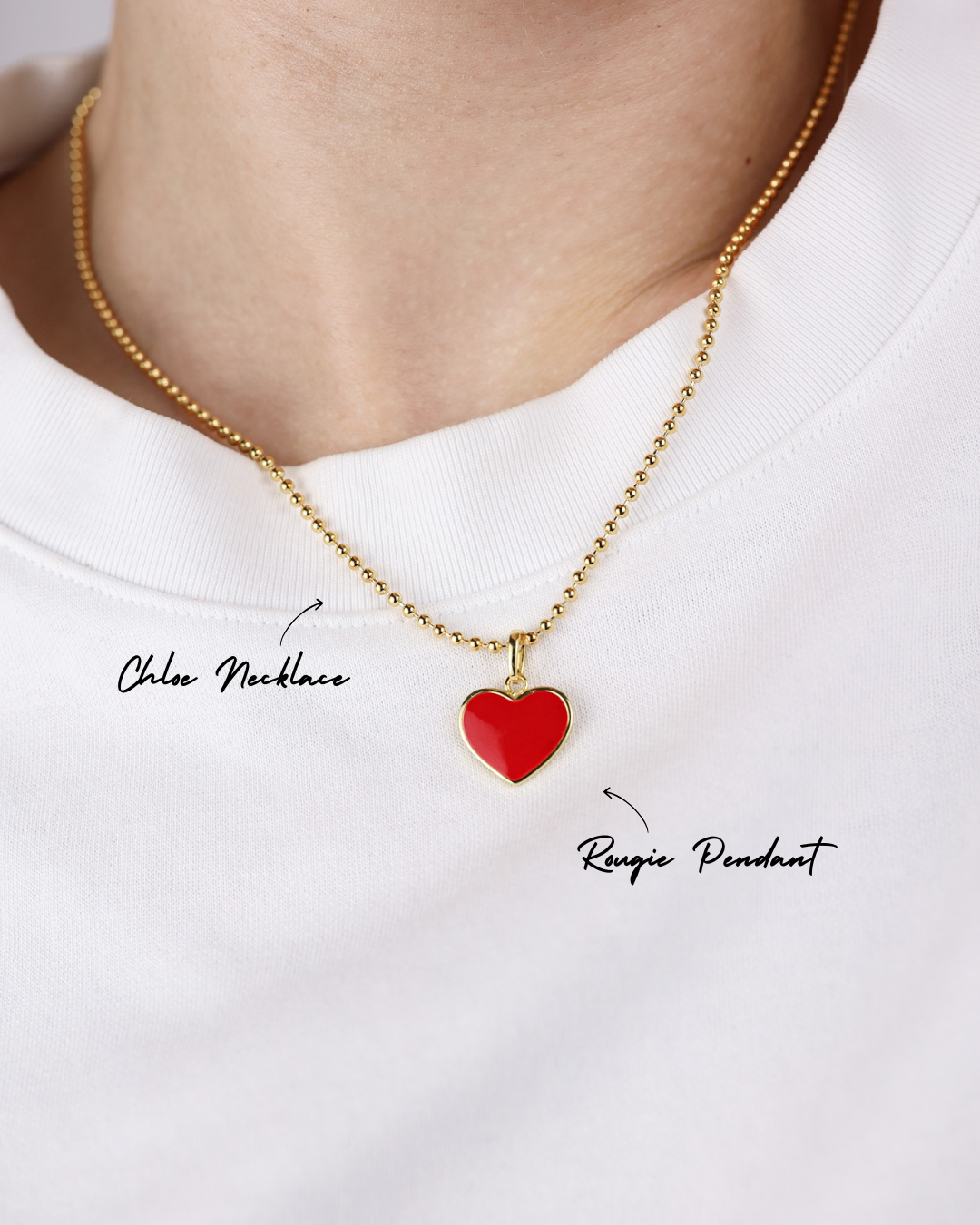 Red heart pendant necklace on a white background