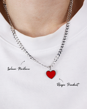 Necklace with a red heart pendant on a white background
