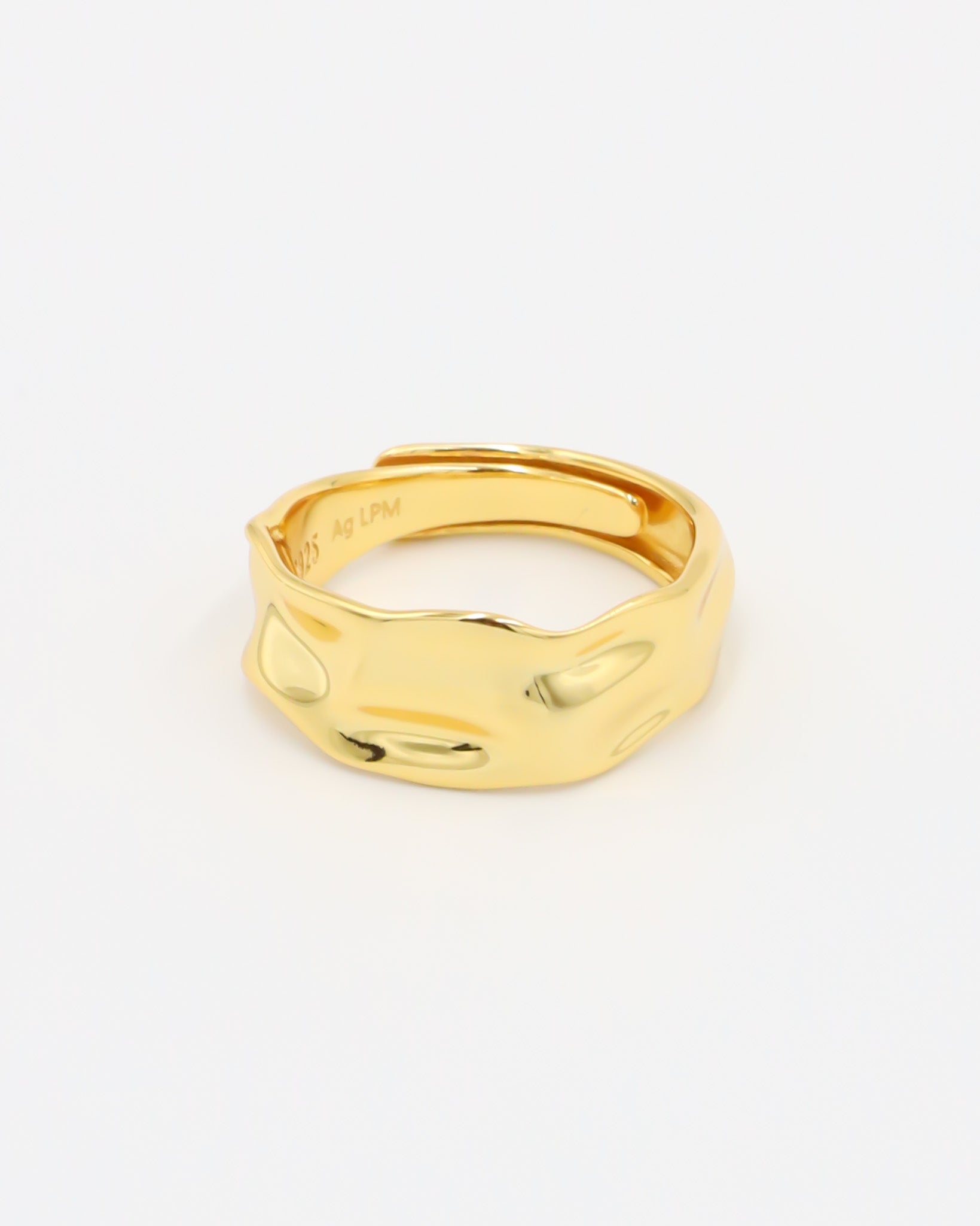 Daphne - adjustable gold-plated sterling silver ring with wavy texture, top view, minimalist design.