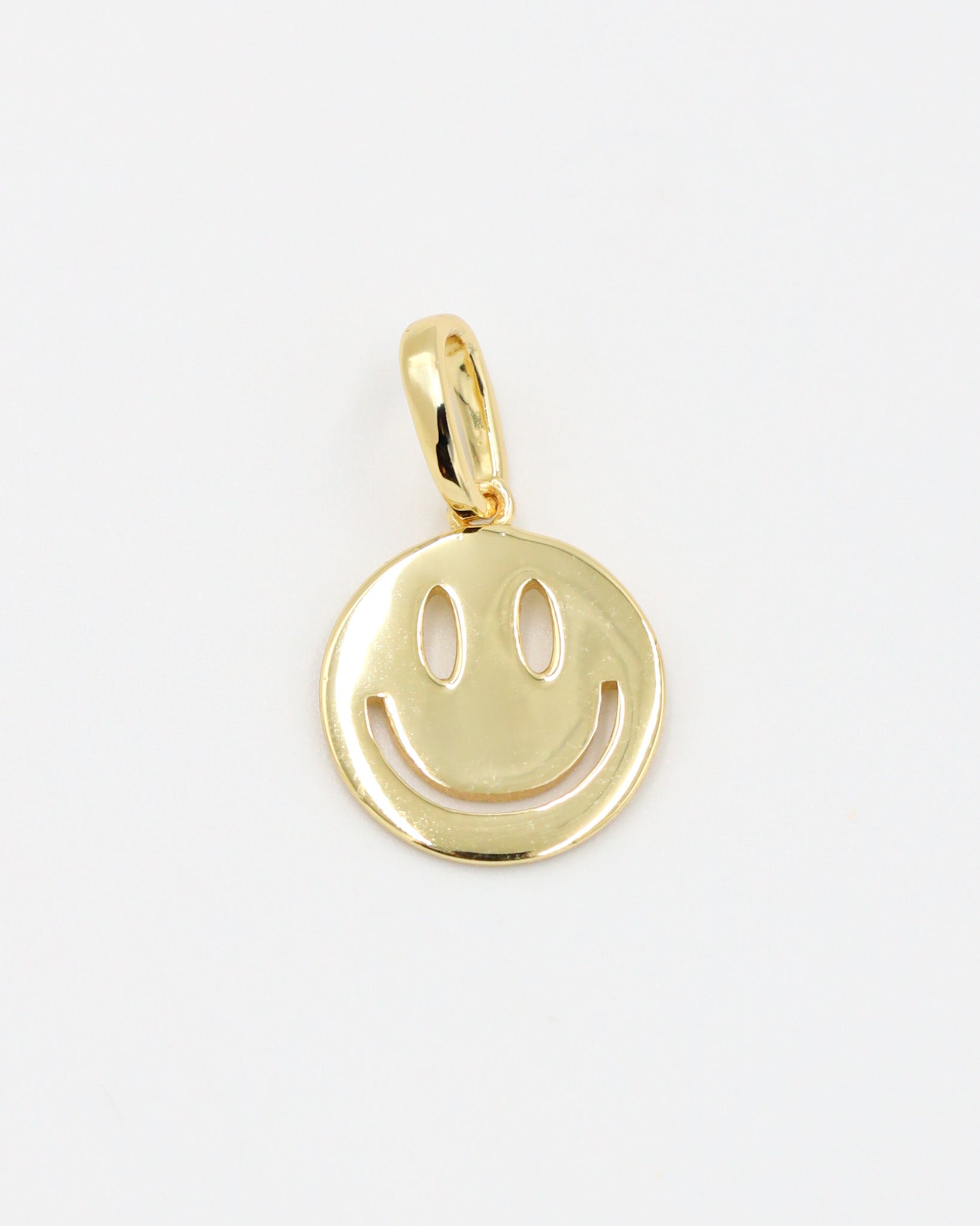 Flynn Gold smiley face pendant crafted in gold-plated 925 sterling silver, shown as a single piece.