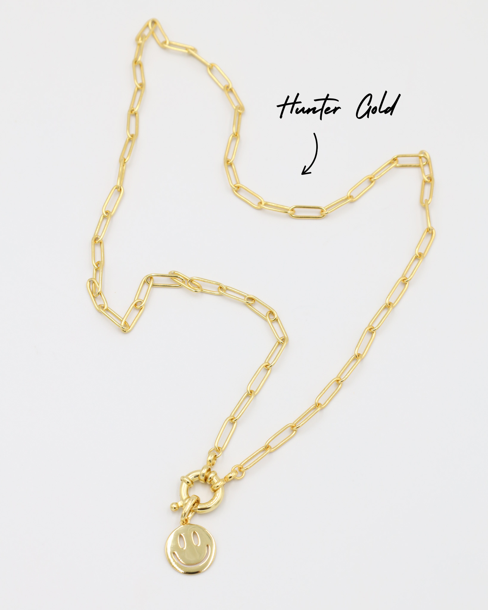 Hunter Gold chain necklace with Flynn Gold smiley face pendant, crafted from gold-plated 925 sterling silver.