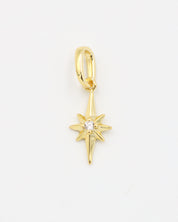 Gold star pendant with a sparkling zirconia stone on a smooth gold finish.