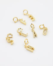 Gold-plated letter pendants with clasp, made from 925 sterling silver, displayed together in various letter designs. Each pendant can be easily attached to any chain necklace.