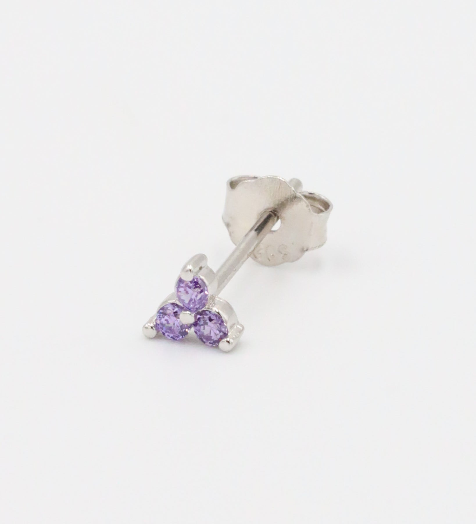 A single Vivian Lavender stud earring in sterling silver, adorned with three lavender zirconia stones.