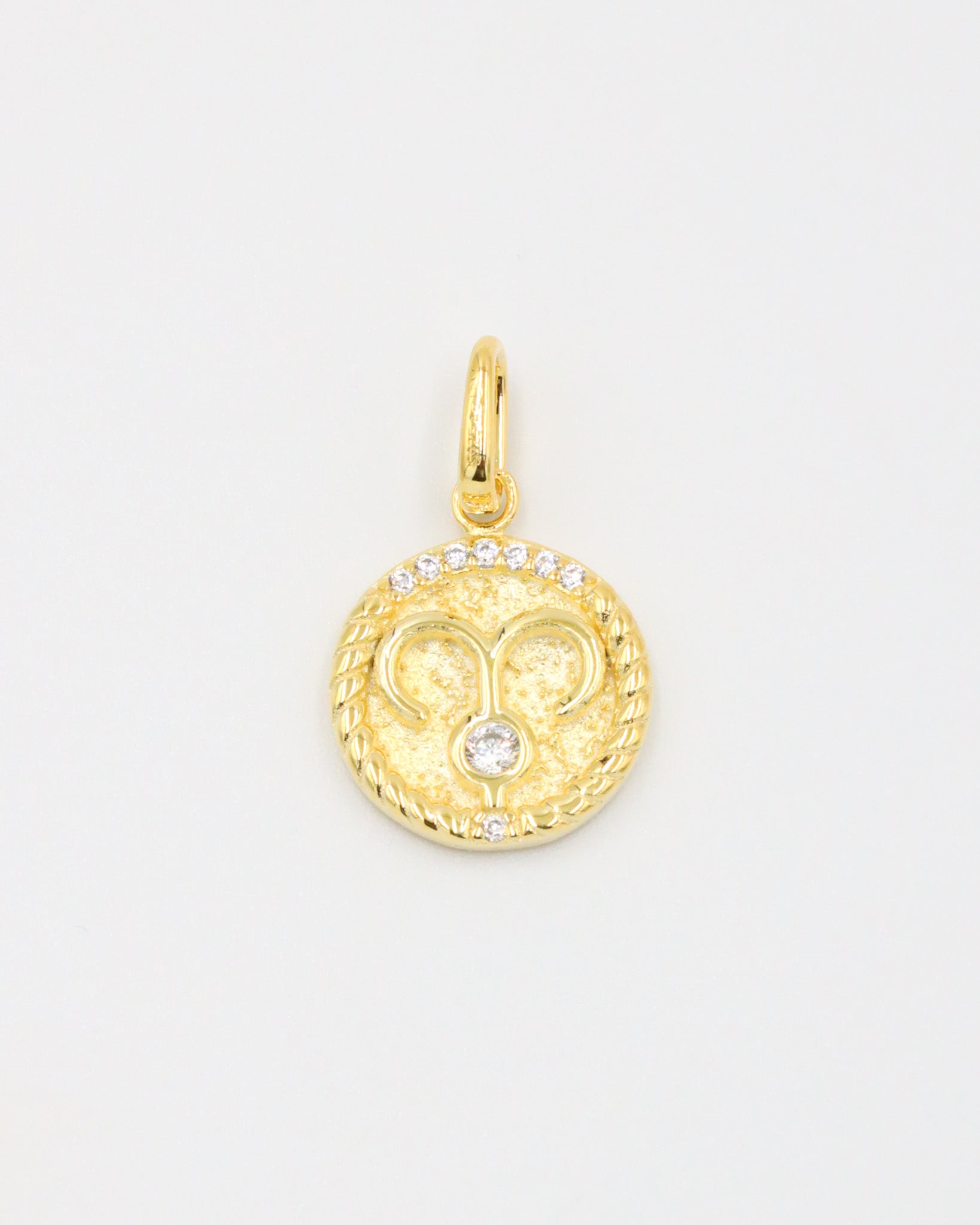 Gold-plated sterling silver Aries zodiac pendant with sparkling zirconia stones.