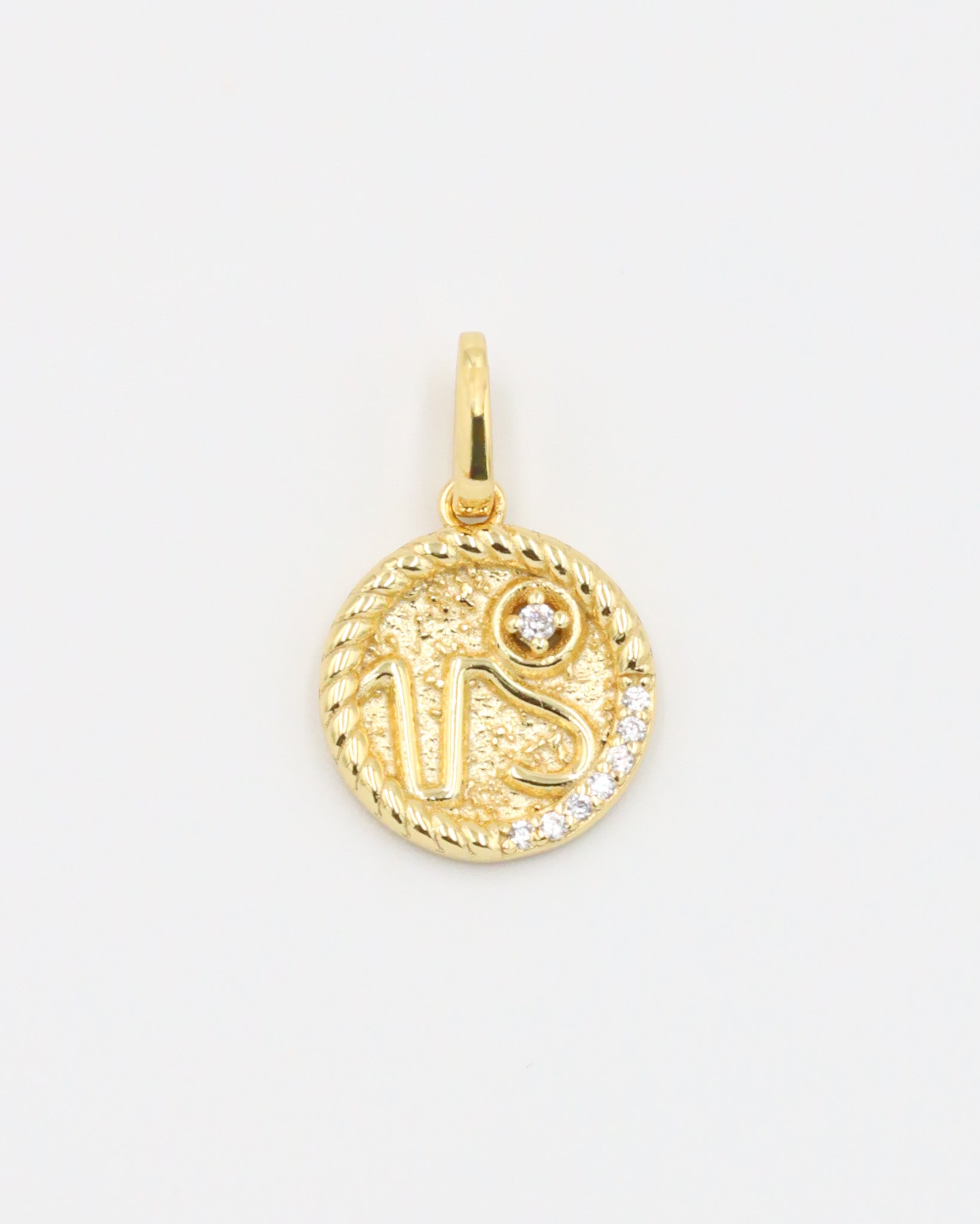 Gold-plated sterling silver Capricorn zodiac pendant with sparkling zirconia stones.
