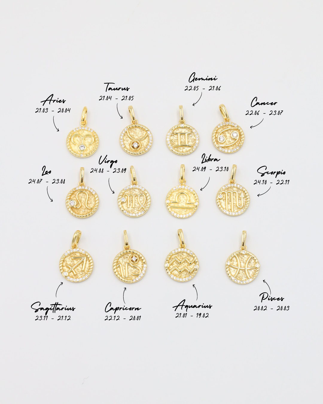 Labeled zodiac pendants in gold-plated sterling silver with zirconia stones, each symbol corresponding to the zodiac signs.