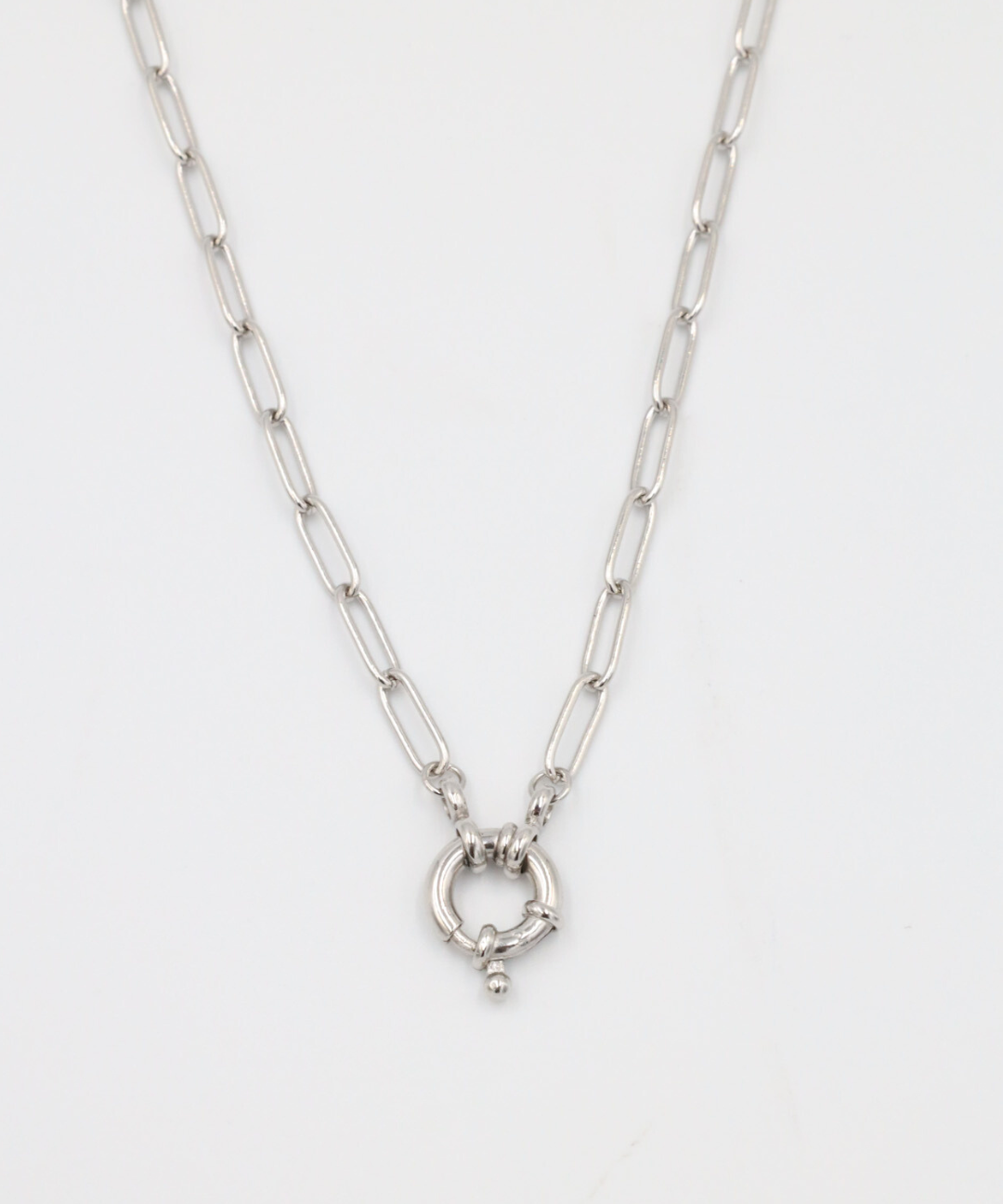 A close-up of the Hunter Necklace in 925 sterling silver featuring an elegant circular clasp on a link chain.