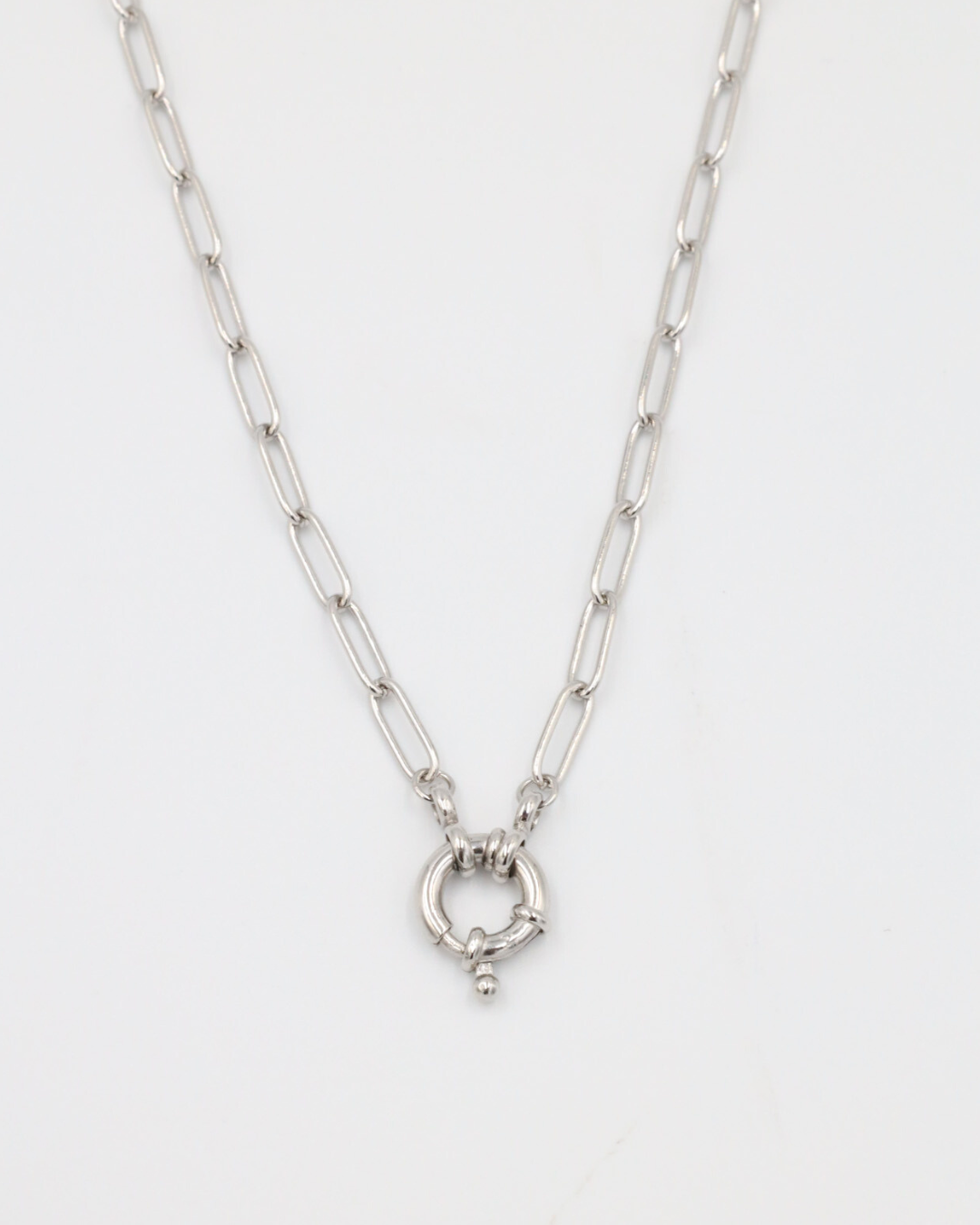 A close-up of the Hunter Necklace in 925 sterling silver featuring an elegant circular clasp on a link chain.