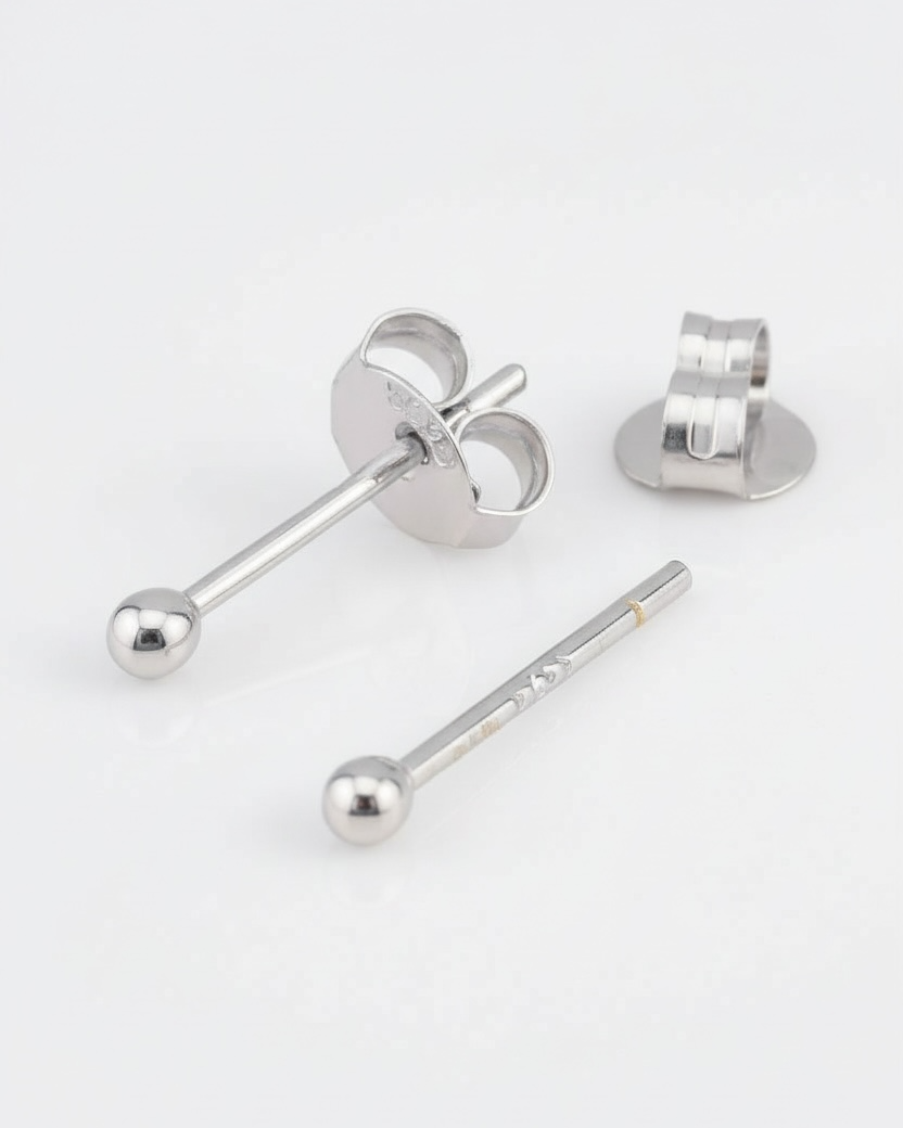 Silver earring components on a white background