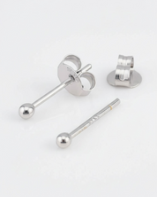 Silver earring components on a white background