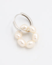 A single silver hoop earring with white pearls attached to it, displayed on a white background.