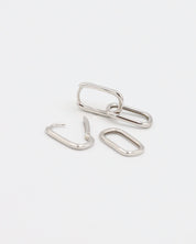 Adelaide earring in silver, shown disassembled with one hoop and two detachable rectangular pendants, displayed on a white background.