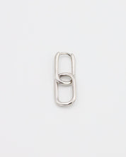 Close-up of a single Adelaide earring by ruru. studios, featuring a modern double-link design in a polished silver finish.