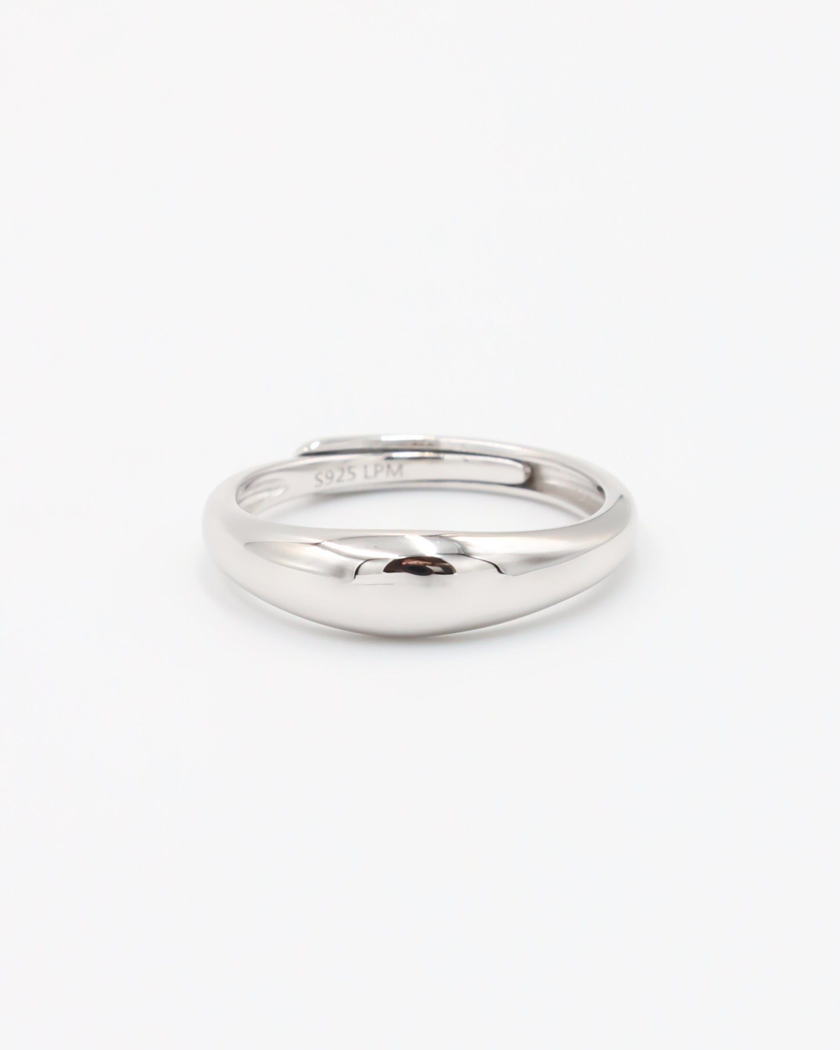 A single silver ring with a smooth, shiny finish displayed against a white background.