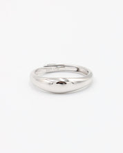 A single silver ring with a smooth, shiny finish displayed against a white background.