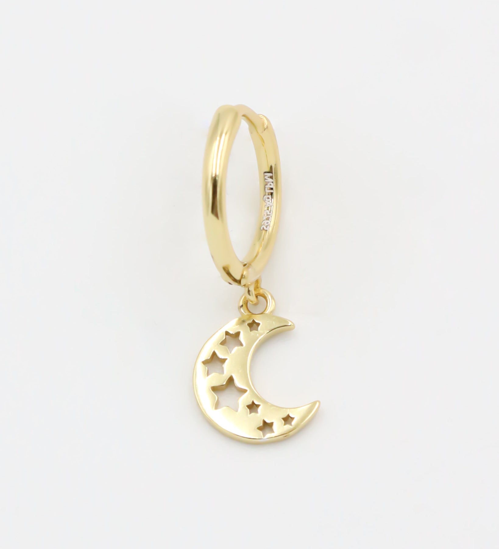 A gold-colored hoop earring with a crescent moon charm attached, set on a white background.