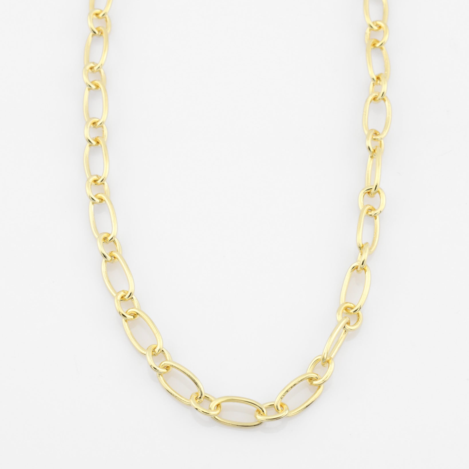 Gold chain necklace on a white background