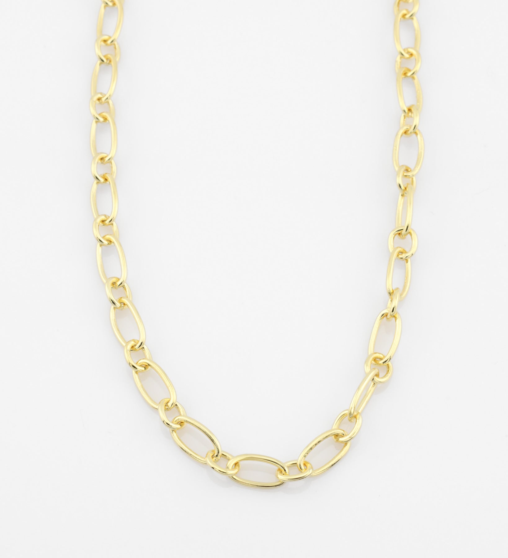 Gold chain necklace on a white background