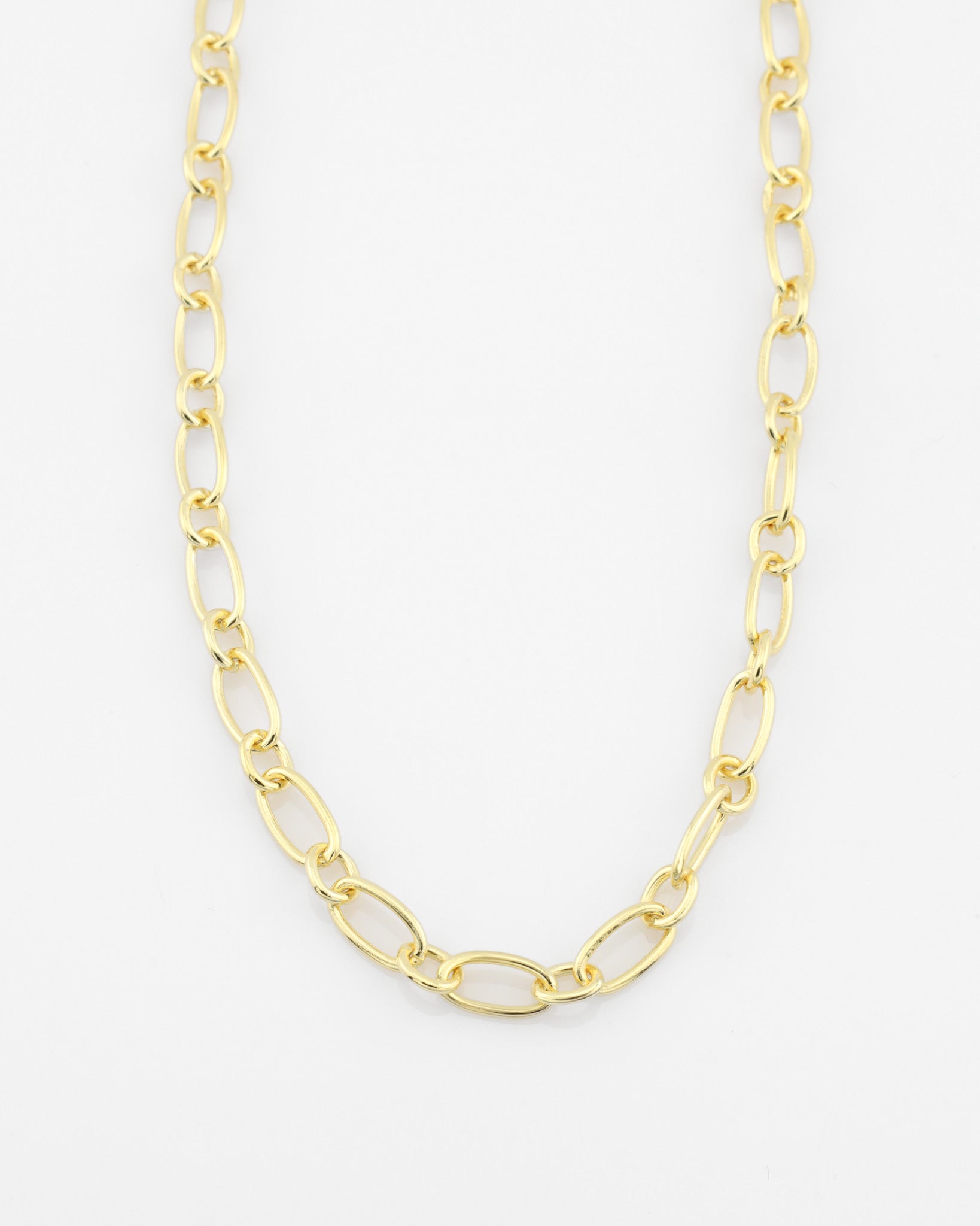 Gold chain necklace on a white background