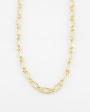 Gold chain necklace on a white background