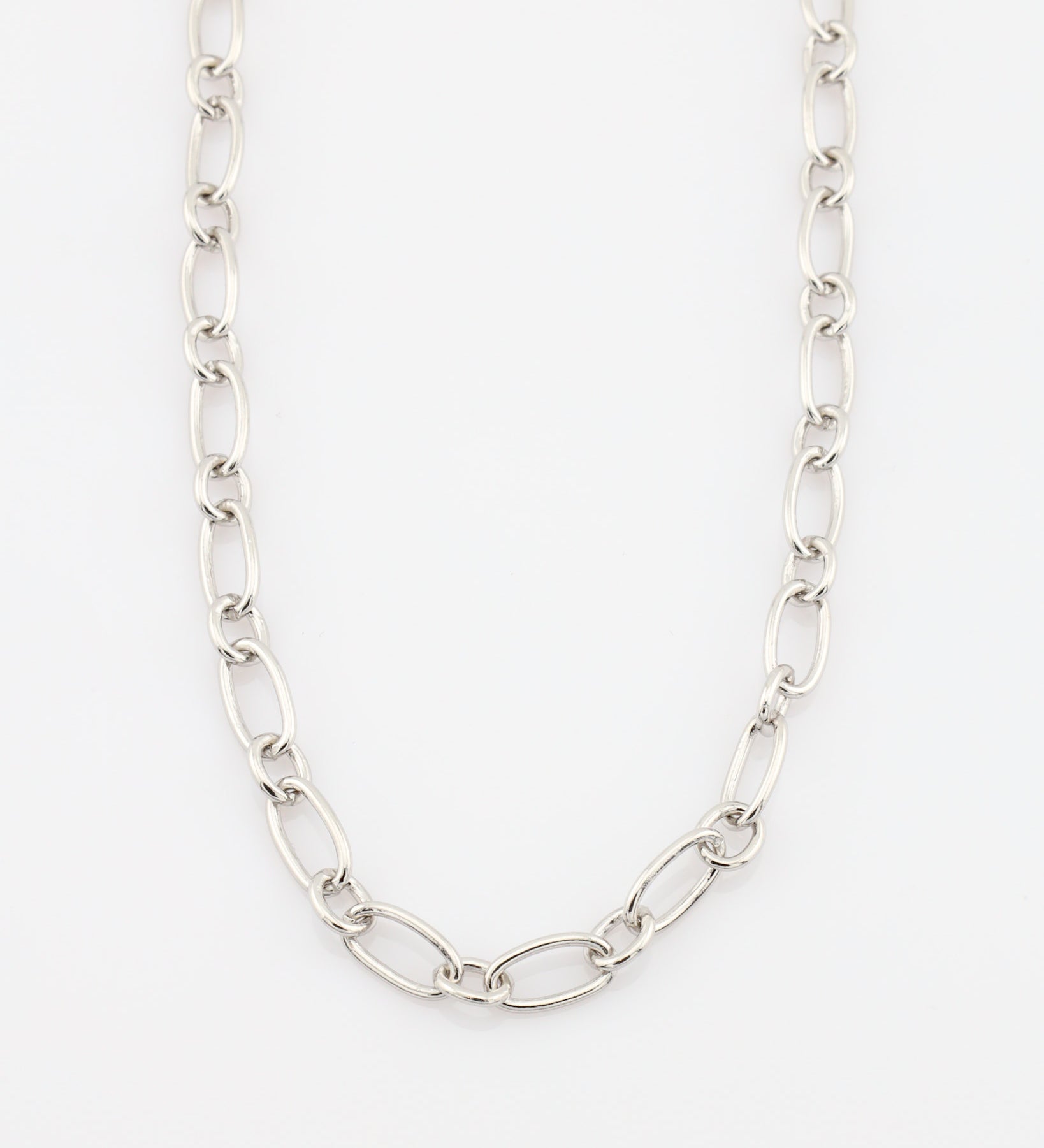 Silver chain necklace on a white background