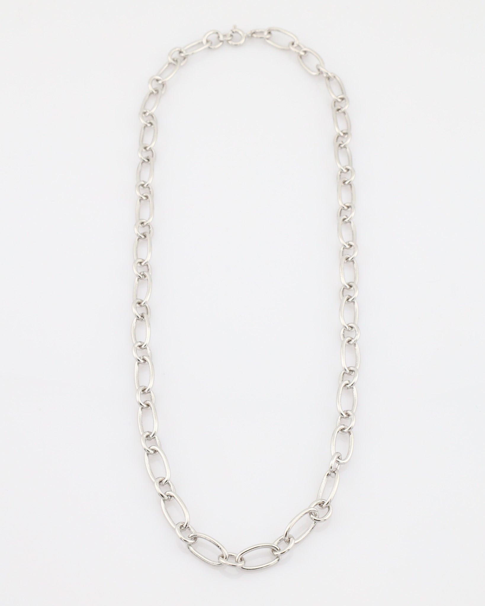 Silver chain necklace on a white background
