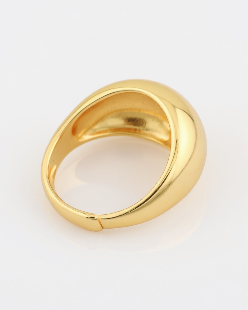 Gold ring on a light gray background