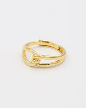 A gold-colored ring with a simple design, featuring two loops that are not connected.