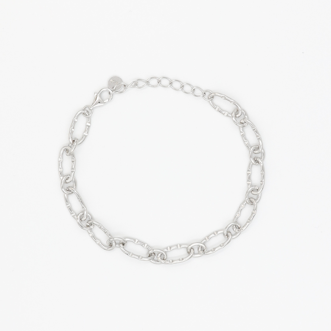 A silver bracelet with a chain link design, displayed against a white background.