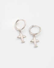 A silver hoop earring with a small airplane charm attached to it, displayed against a white background.