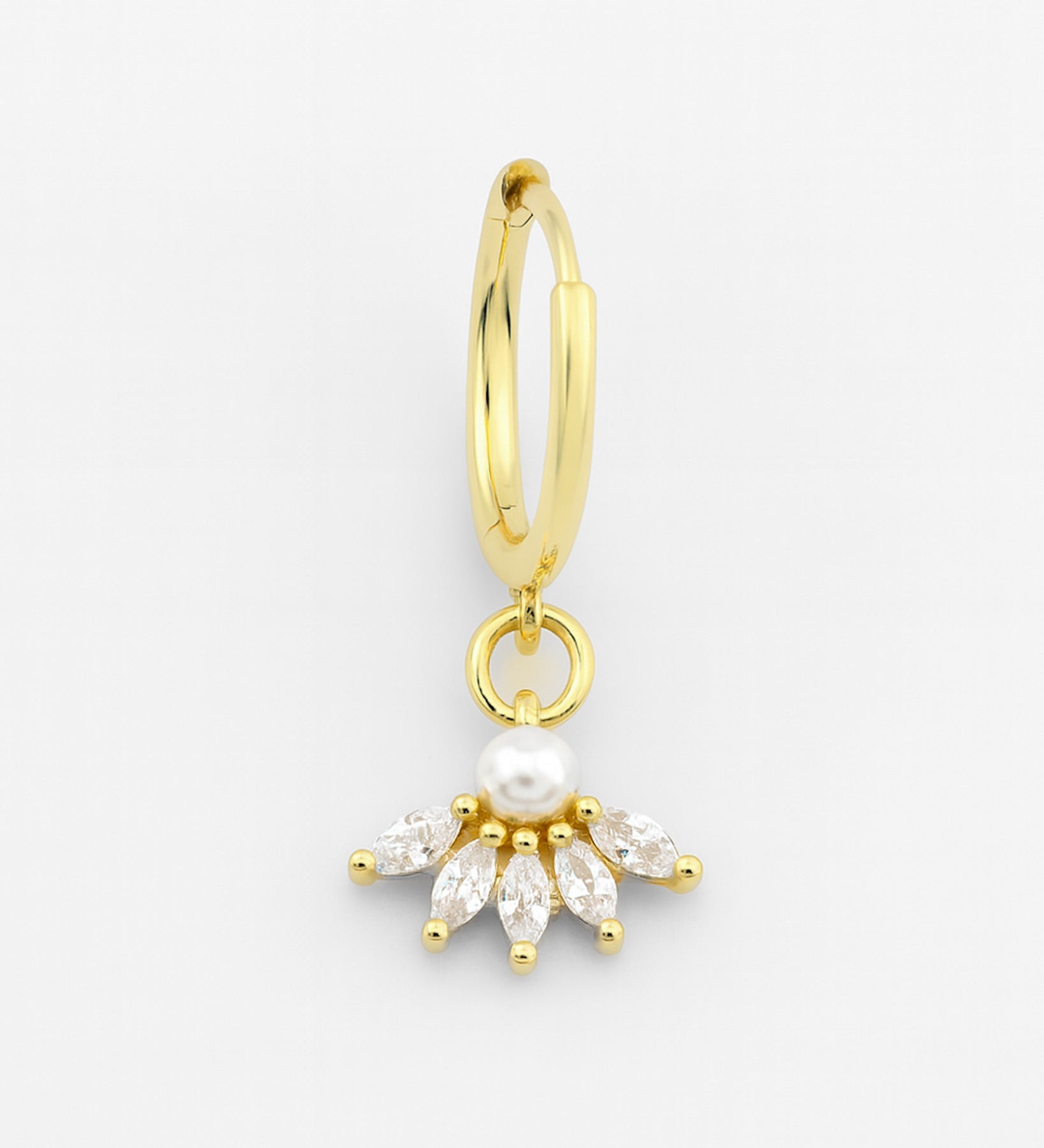 Gold hoop earring with a pearl and diamond-like stone on a white background