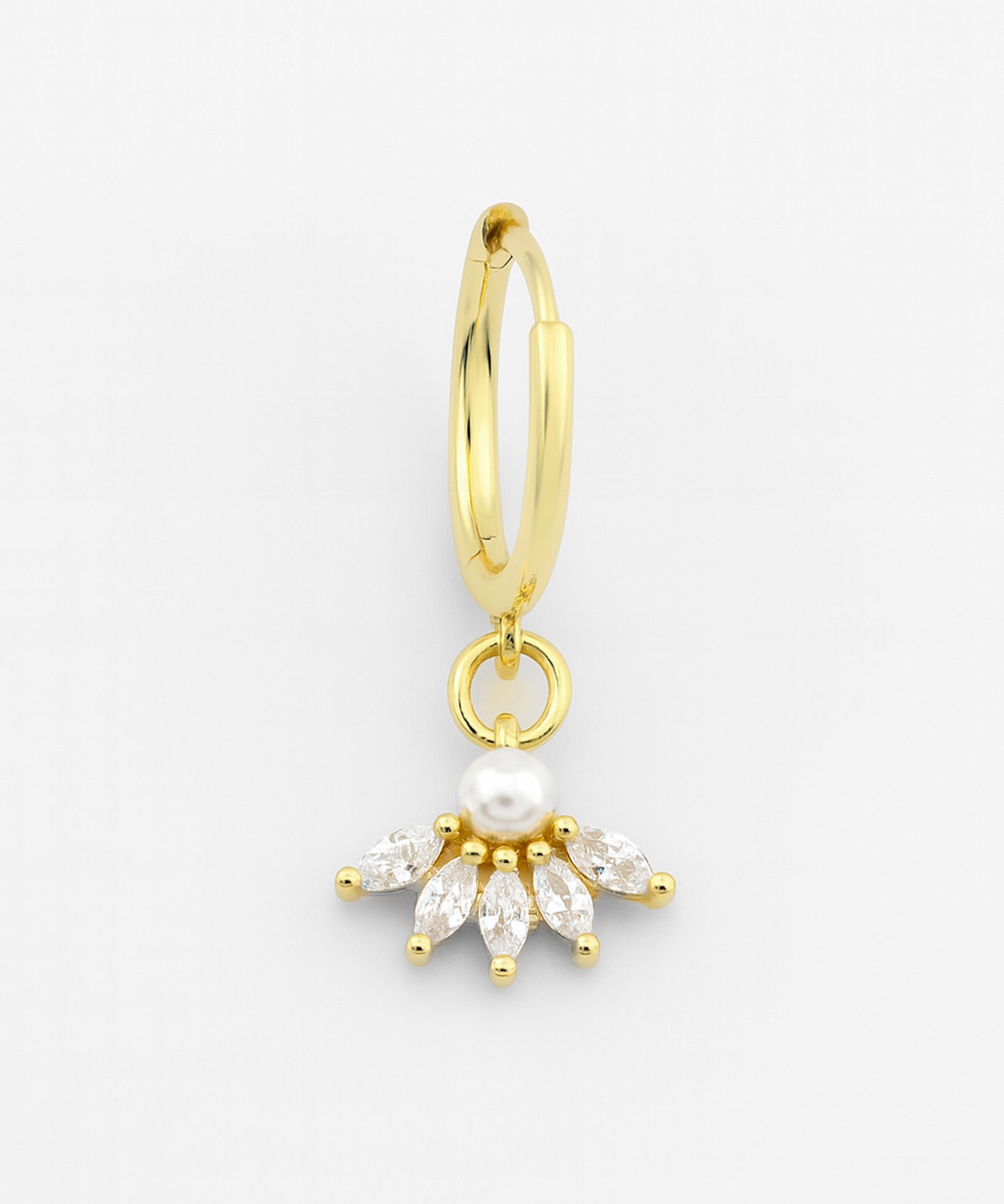 Gold hoop earring with a pearl and diamond-like stone on a white background