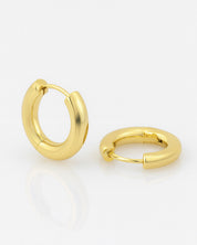Gold hoop earrings on a white background