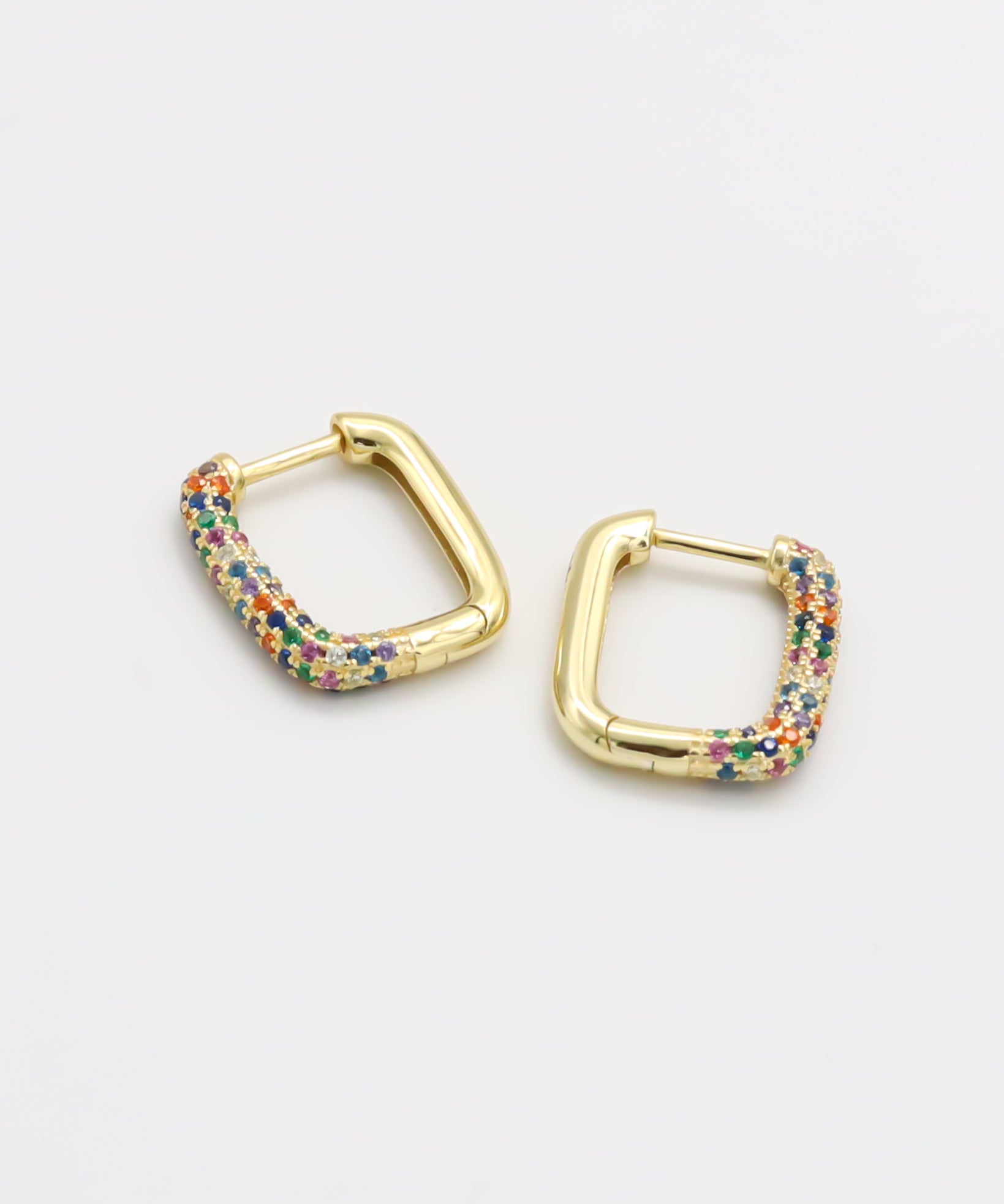 A single multicolor gold hoop earring with a hinged clasp, displayed against a white background.