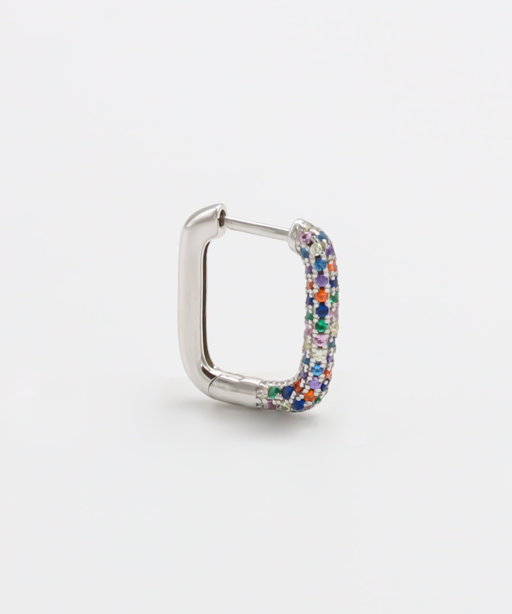 A multicolor silver hoop earring with a hinged clasp, against a white background.