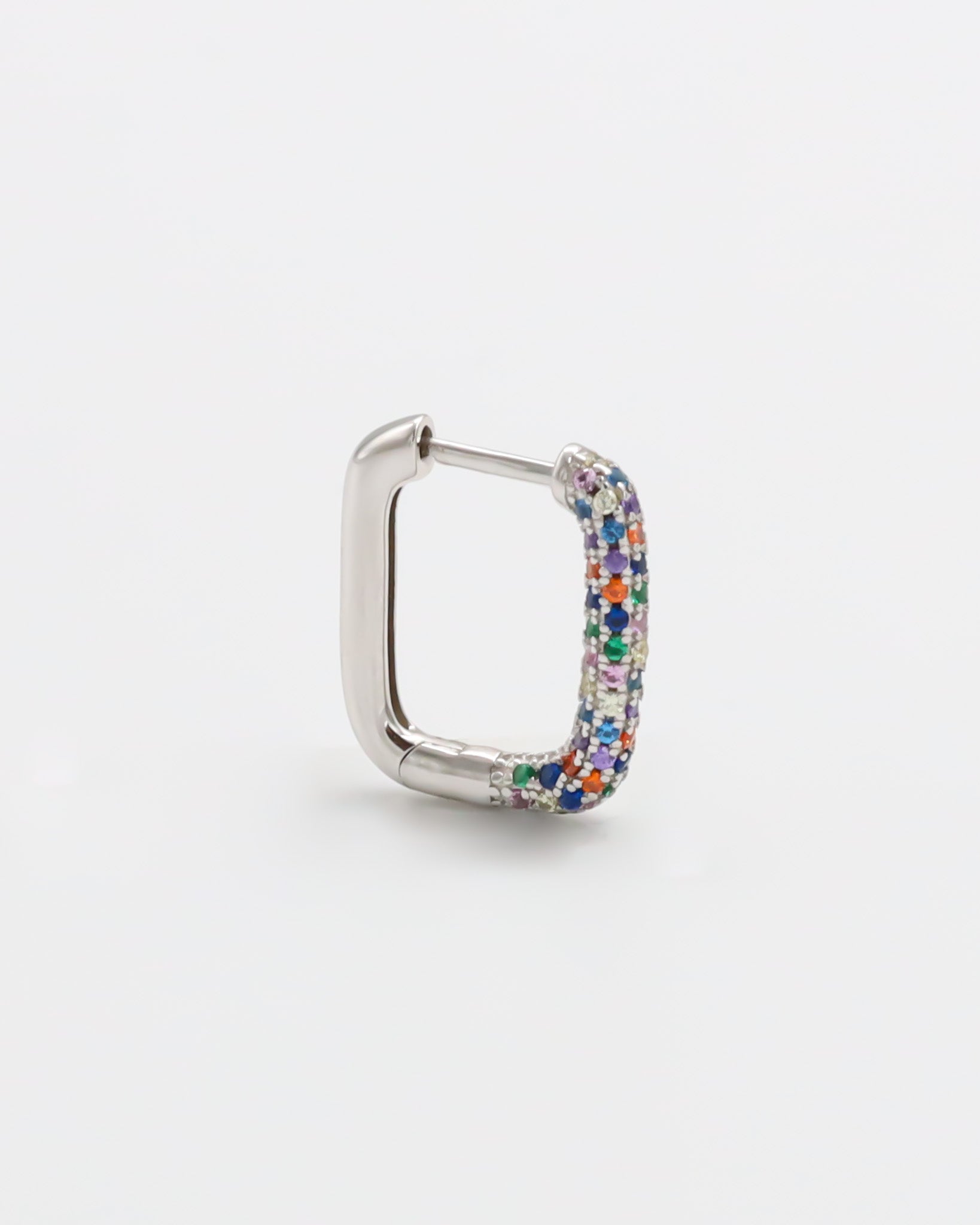 A multicolor silver hoop earring with a hinged clasp, against a white background.
