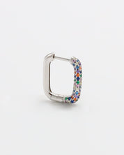 A multicolor silver hoop earring with a hinged clasp, against a white background.