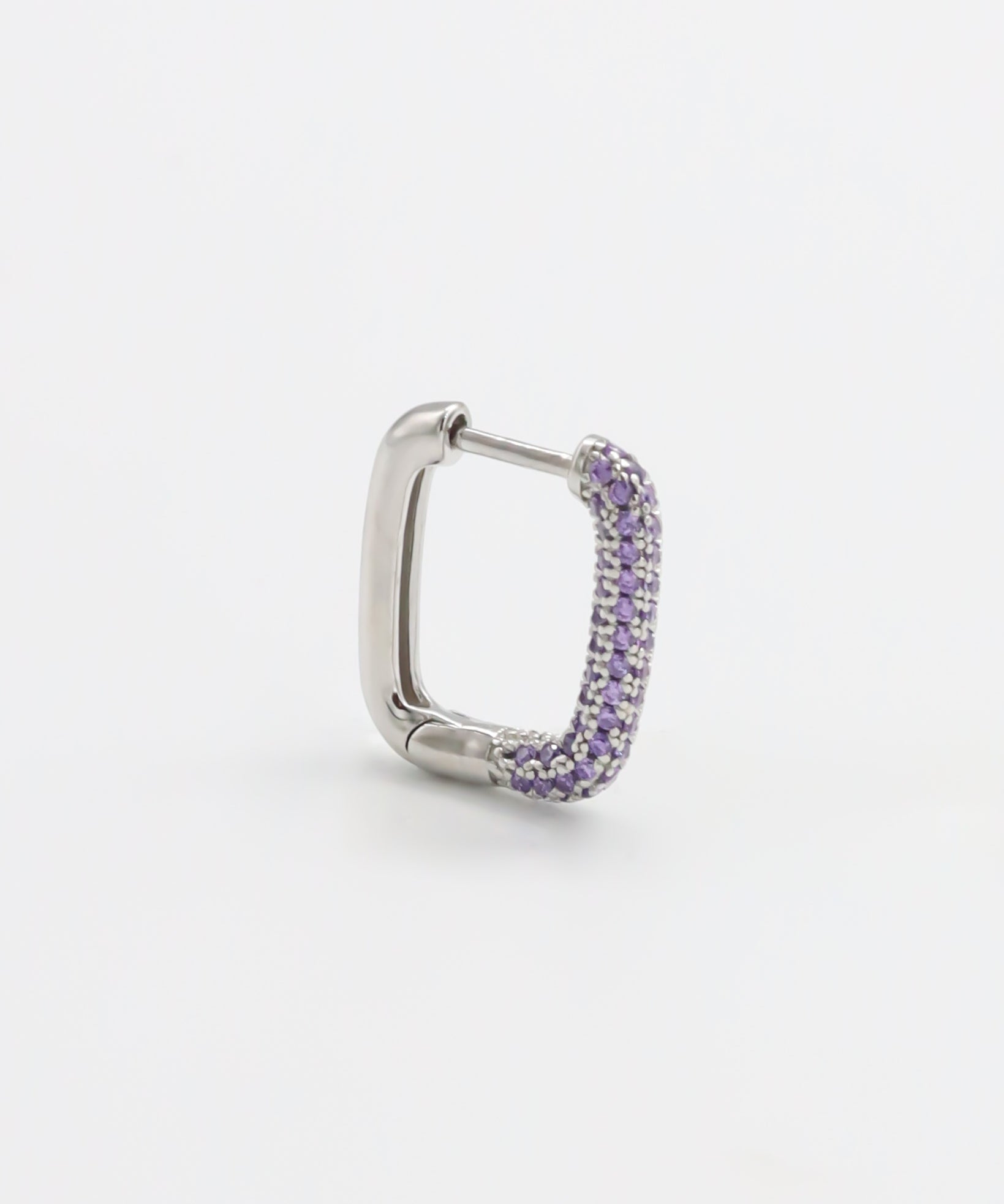 A single silver hoop earring with a hinged clasp and purple gemstone detailing.
