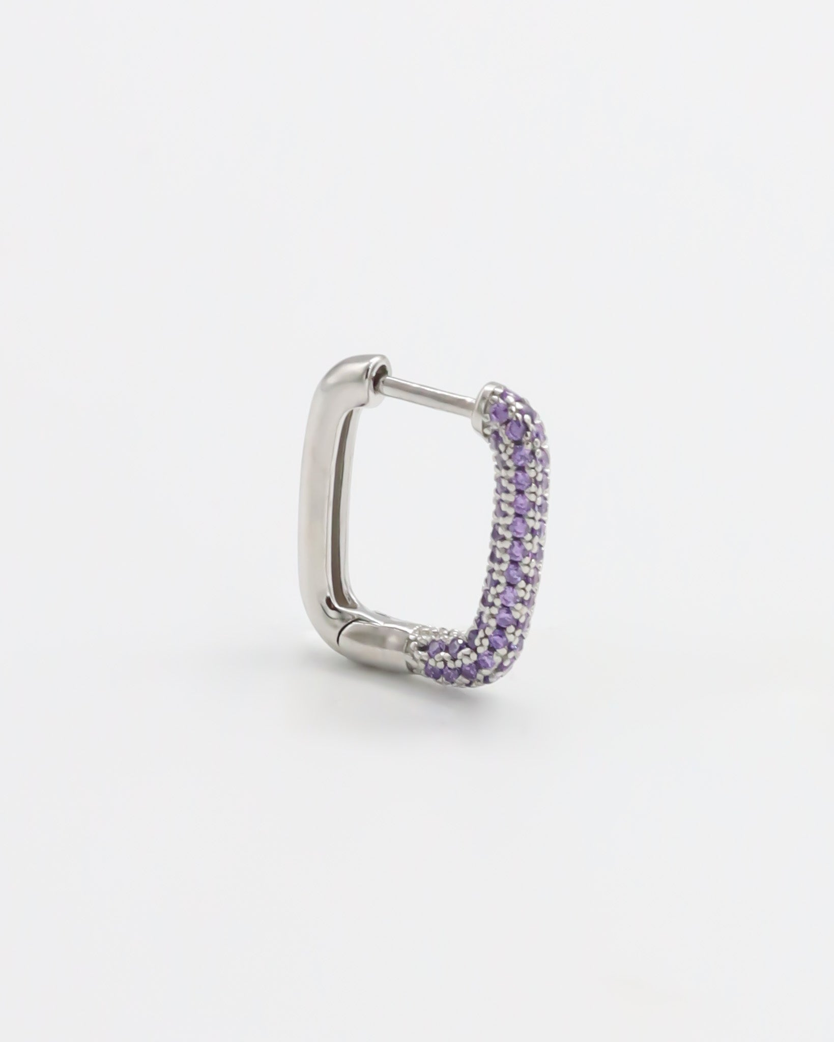 A single silver hoop earring with a hinged clasp and purple gemstone detailing.