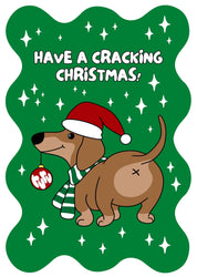 A greeting card with a cartoon illustration of a dog wearing a Santa hat and a scarf, with the text 'HAVE A CRACKING CHRISTMAS!' set against a green background with star decorations.