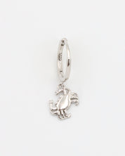A silver-colored hoop earring with a crab charm attached to it.